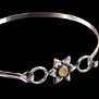 PULSERA PLATA Y ORO CON FLOR DE 6 PETALOS